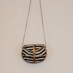 Metal hand crafted clutch in black and white.